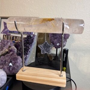 Crystal clear quartz bracelet rod and display stand with wooden base